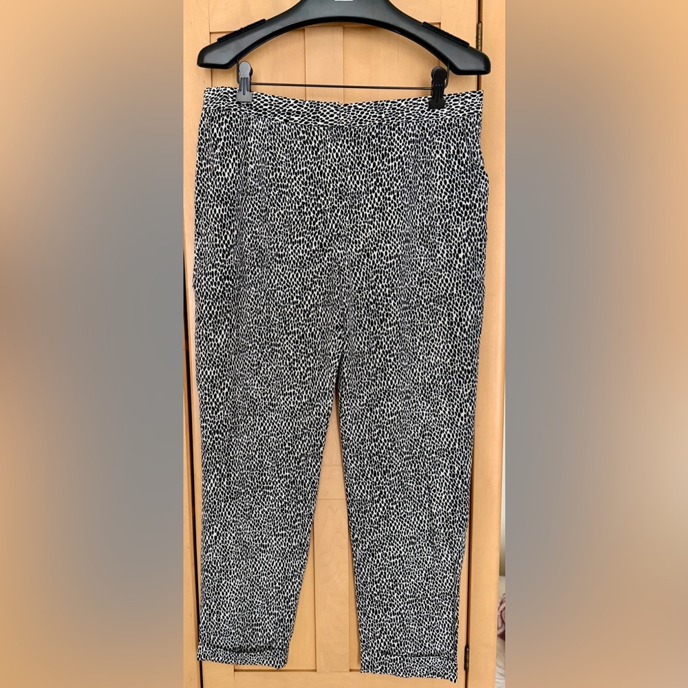 THEORY silk animal print trousers with side pockets and cuffs.